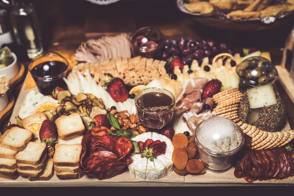 Savor this vibrant charcuterie board filled with meats, cheeses, fruits, and nuts, perfect for gatherings.
